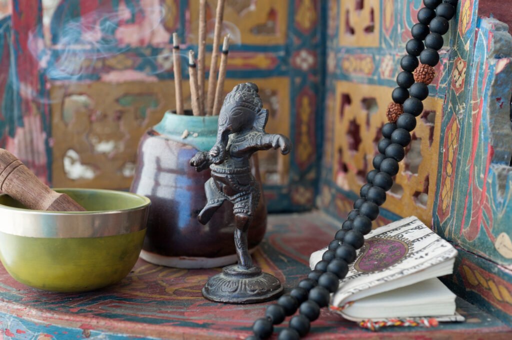 The Wisdom of Borrowing Without Belonging: Why Adopting Cross-Cultural Rituals Beats Religious Conversion for Modern Mental Health personal yoga shrine. still life photography.